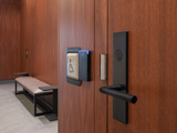 Image of a wooden door with lock, access control reader, and wheelchair button