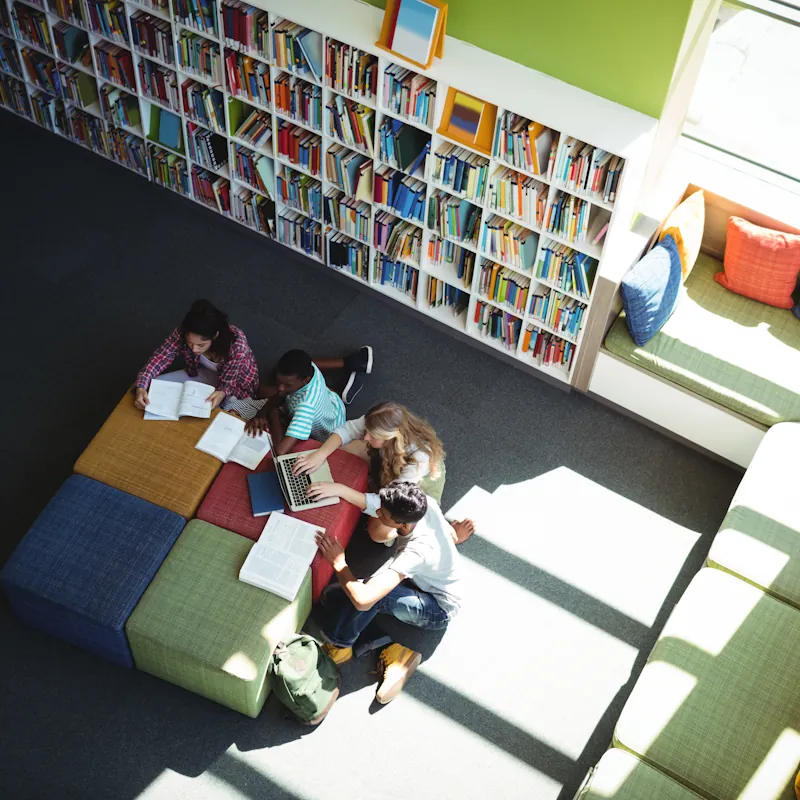 Children reading books in a library