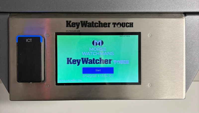 Close-up of a KeyWatcher Touch key management cabinet with an ICT badge reader