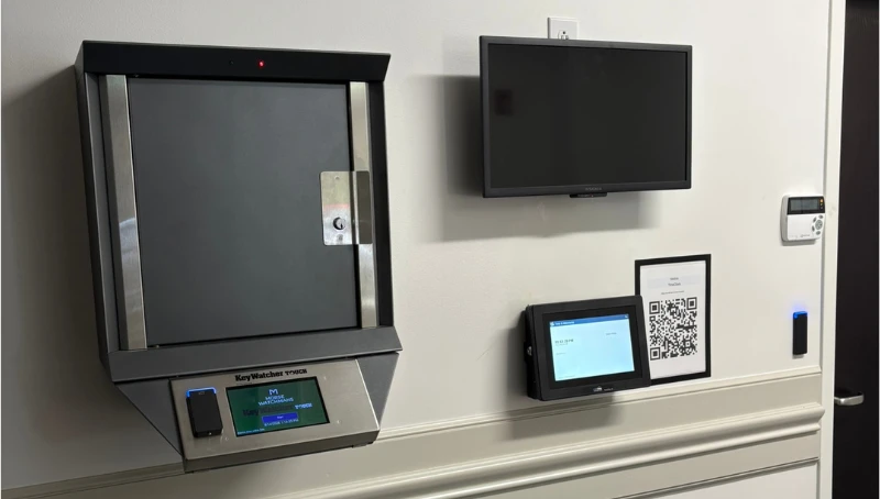 KeyWatcher key management cabinet, wall-mounted display and ICT access control reader in a City of Mooresville hallway