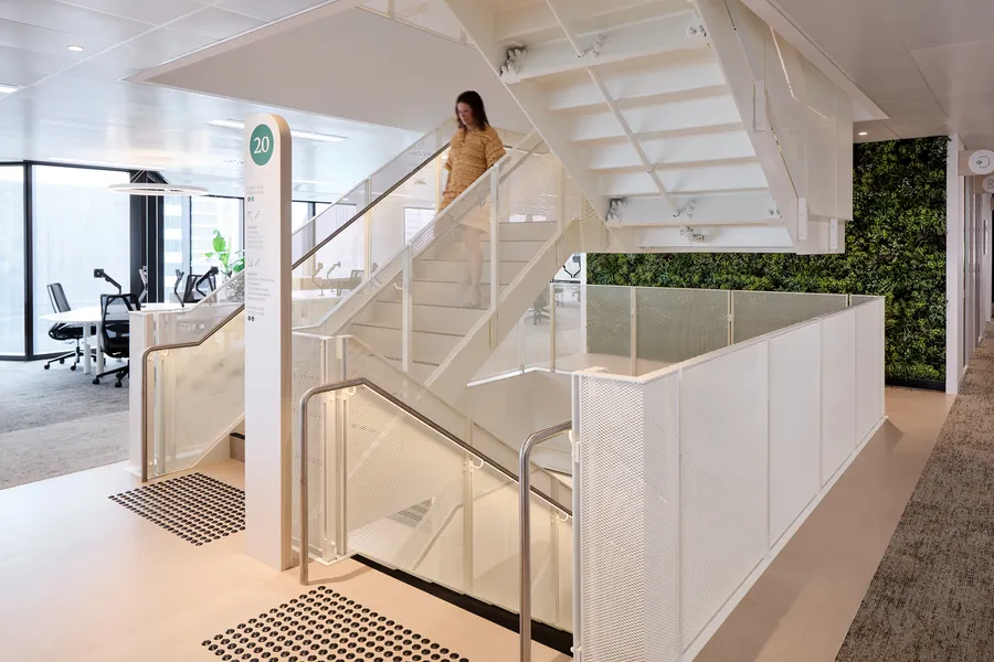 The interconnecting stair and green wall inside Insignia Financial's Parkline Place tenancy