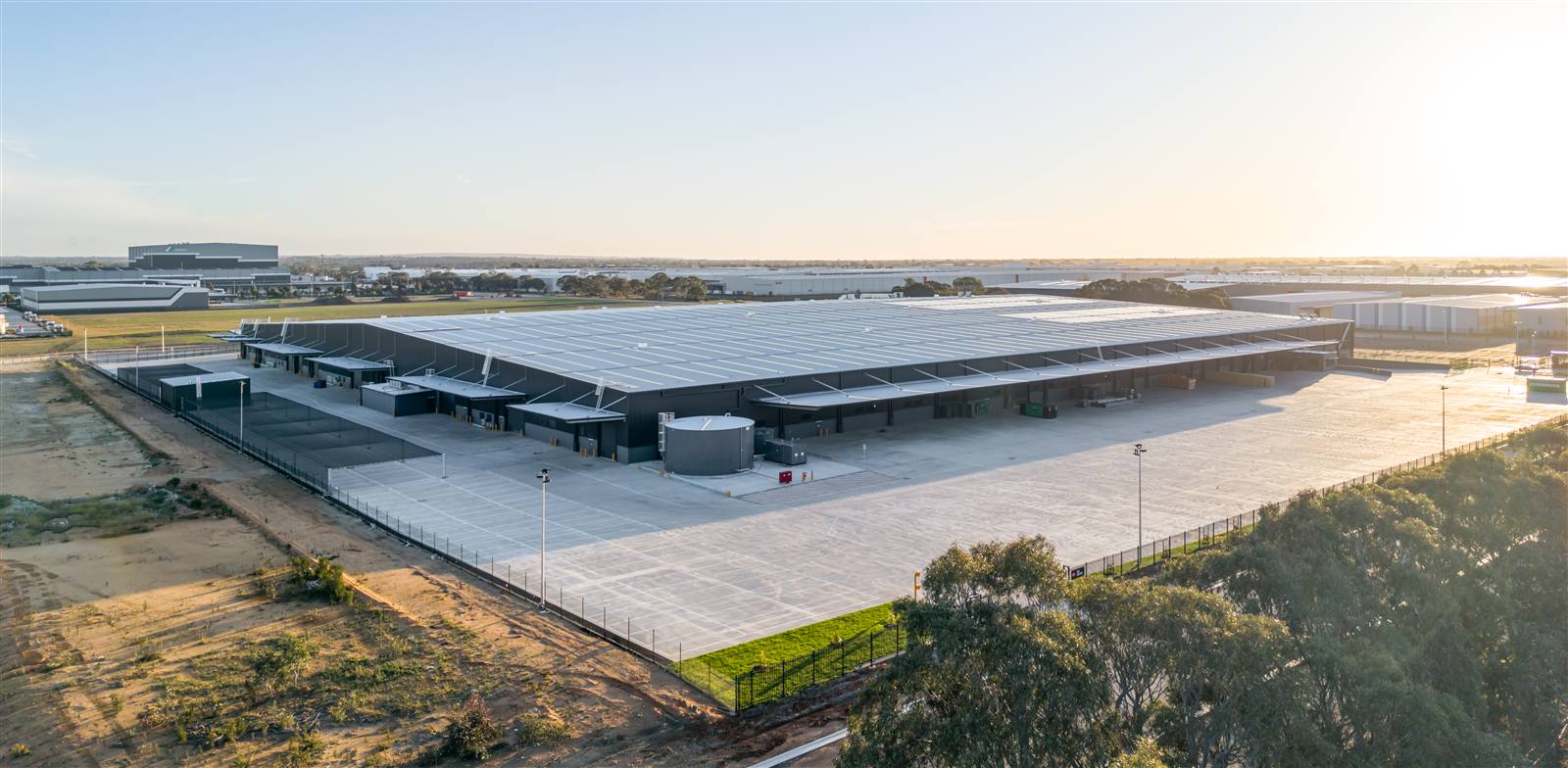 Aerial view of the Walkinshaw Group manufacturing campus at sunset
