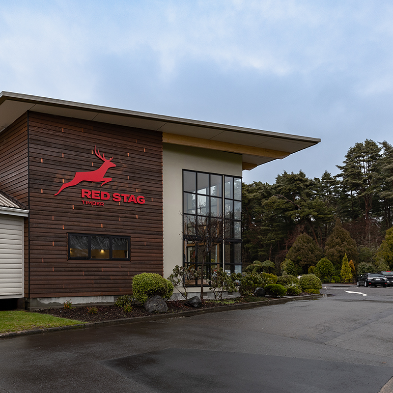 Red Stag Timber office building with trees in background